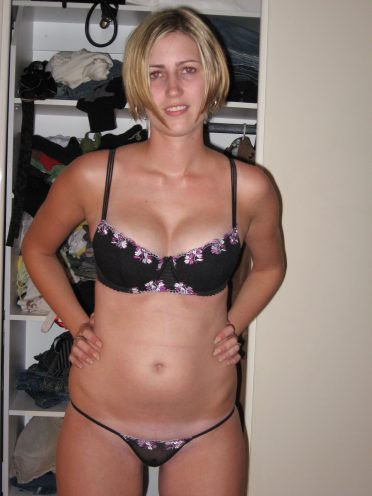 Blonde milf in bra and panties showing little tan line